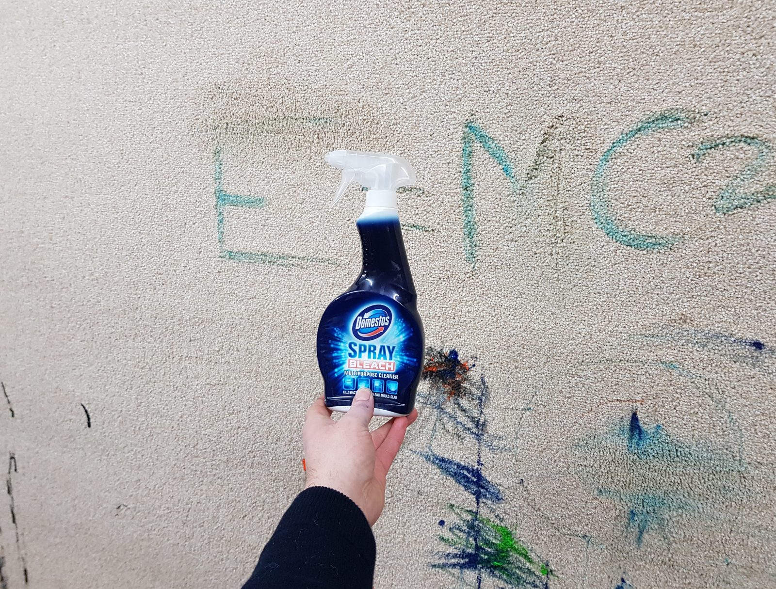 Bleach spray ready to tackle the carpet scribbles