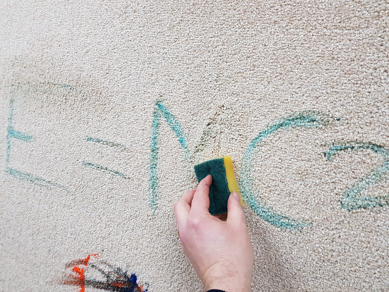Scribbles wiping clean away from the bleach cleanable carpet
