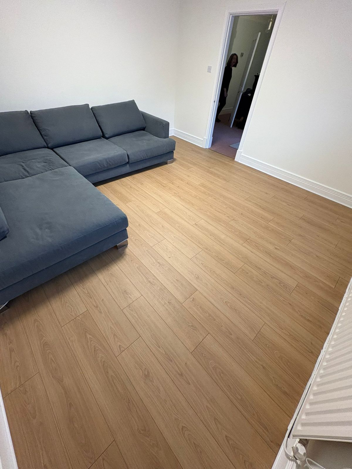 Light oak laminate flooring in a cosy living room