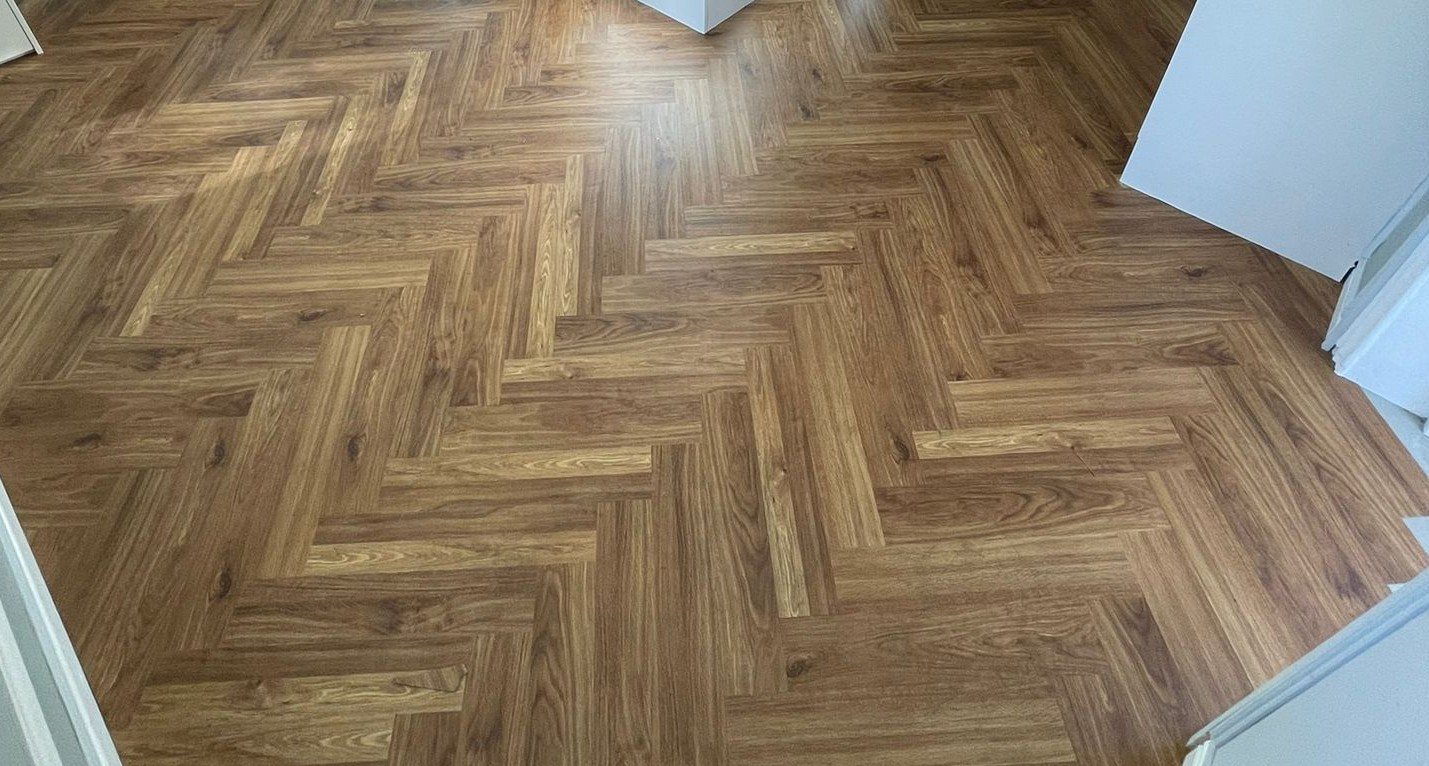 Oak herringbone LVT fitted across a full room
