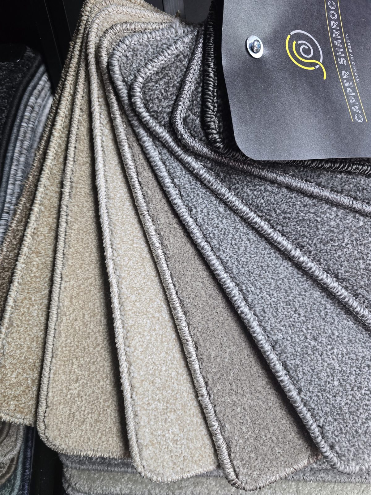 Fan of carpet samples in different shades