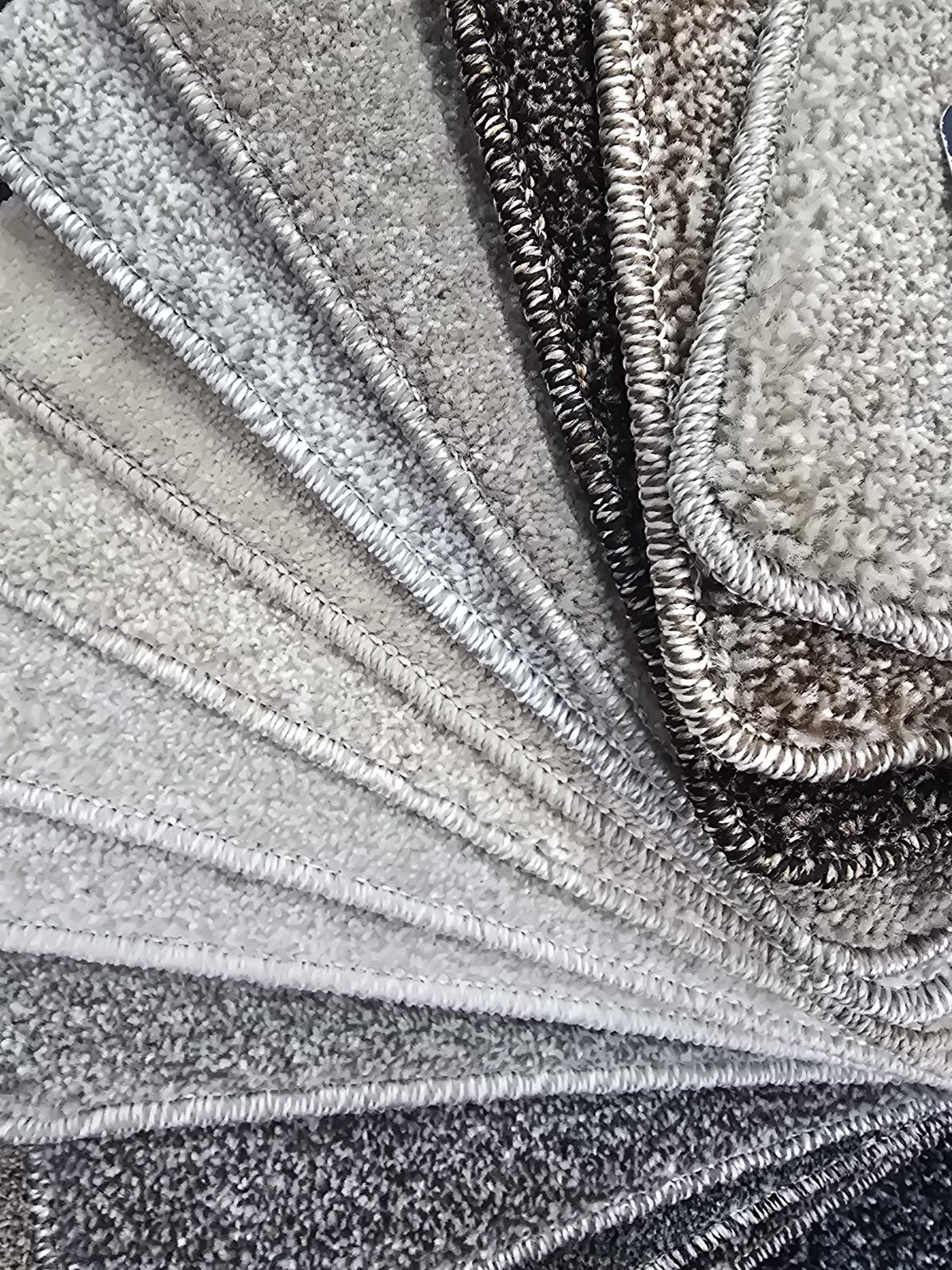 Thick carpet samples in greys and neutrals