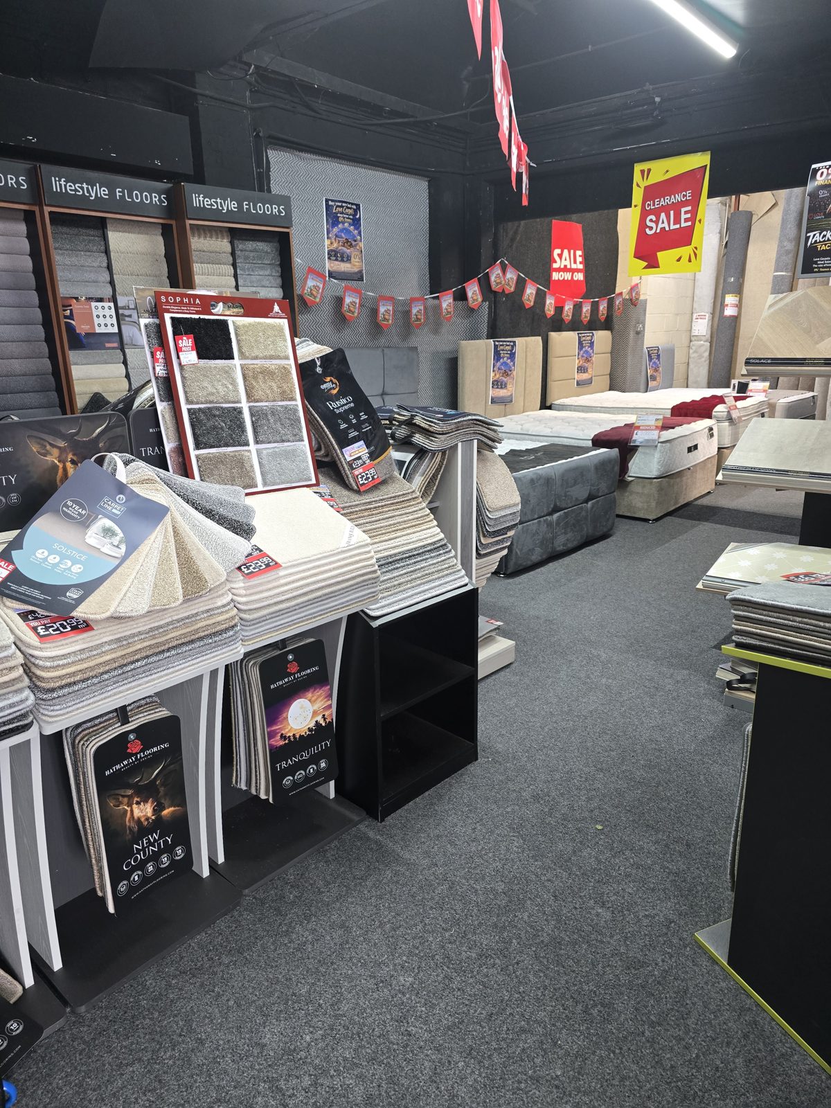 Flooring displays and offers inside the Love Carpets showroom