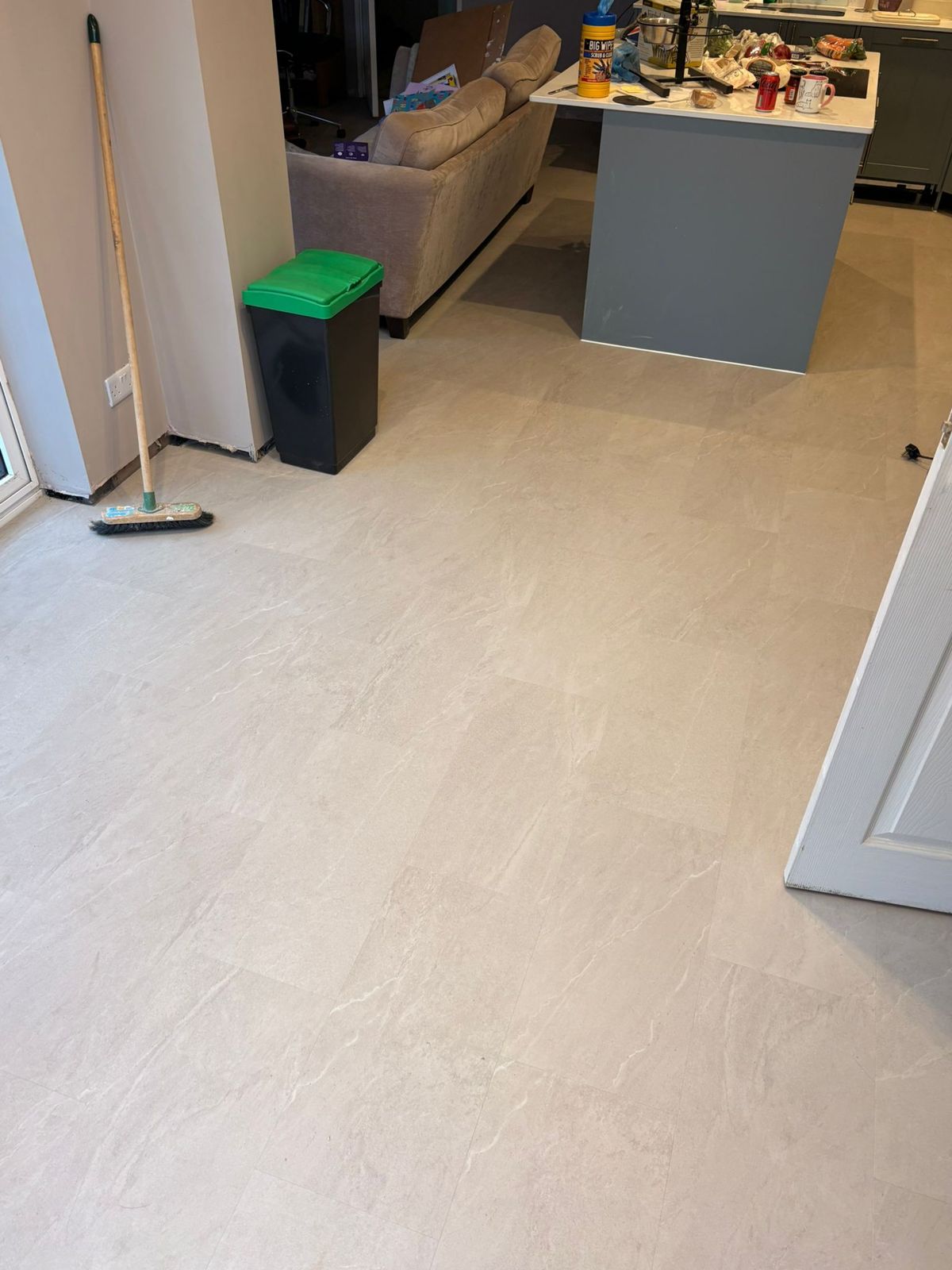 Stone tile-effect LVT in an open-plan kitchen