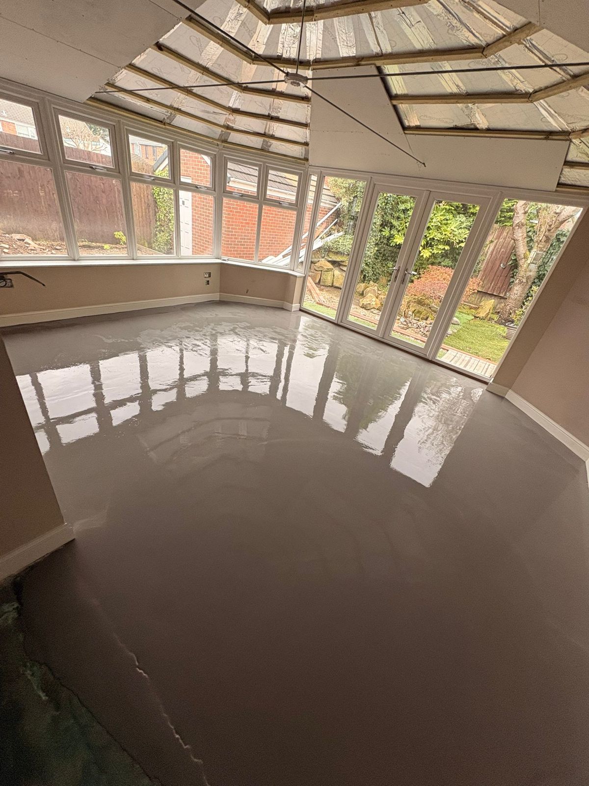 Subfloor levelling compound before LVT fitting in a Warrington conservatory